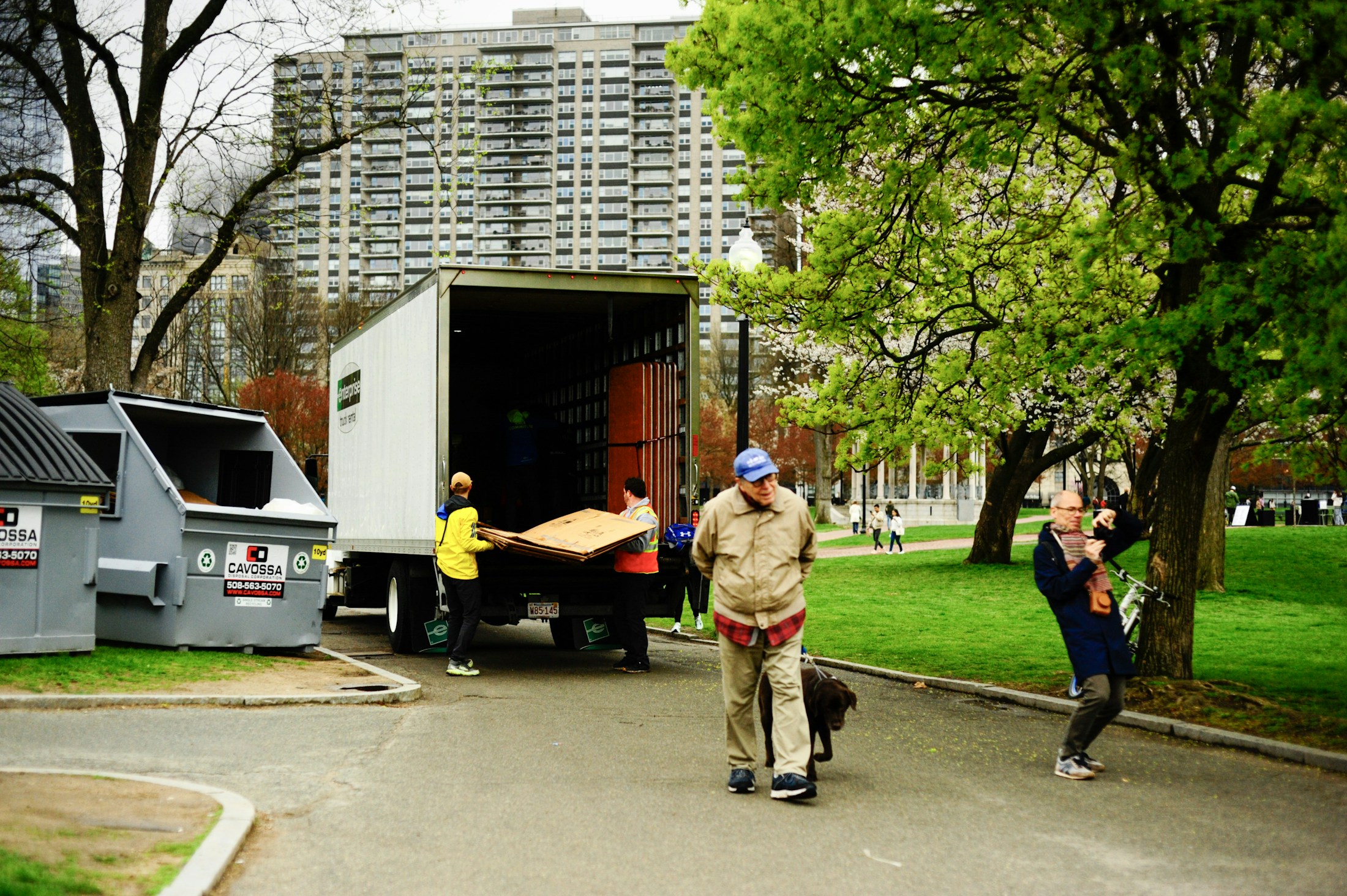 Professional movers unloading furniture from a moving truck
